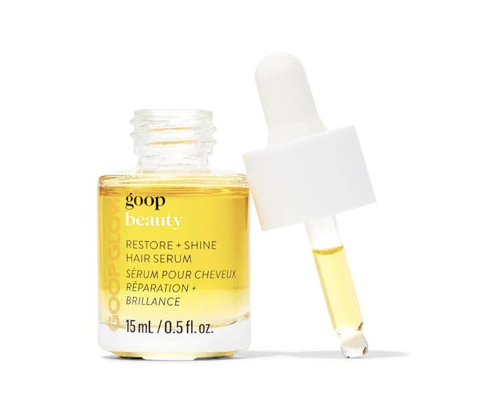 Goop Beauty hair serum bottle with dropper, text emphasizes hair restoration and shine properties