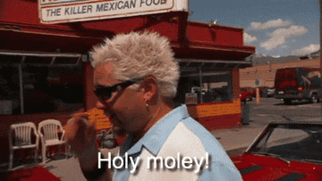 Gif of Guy Fieri exclaiming &quot;Holy moley&quot;