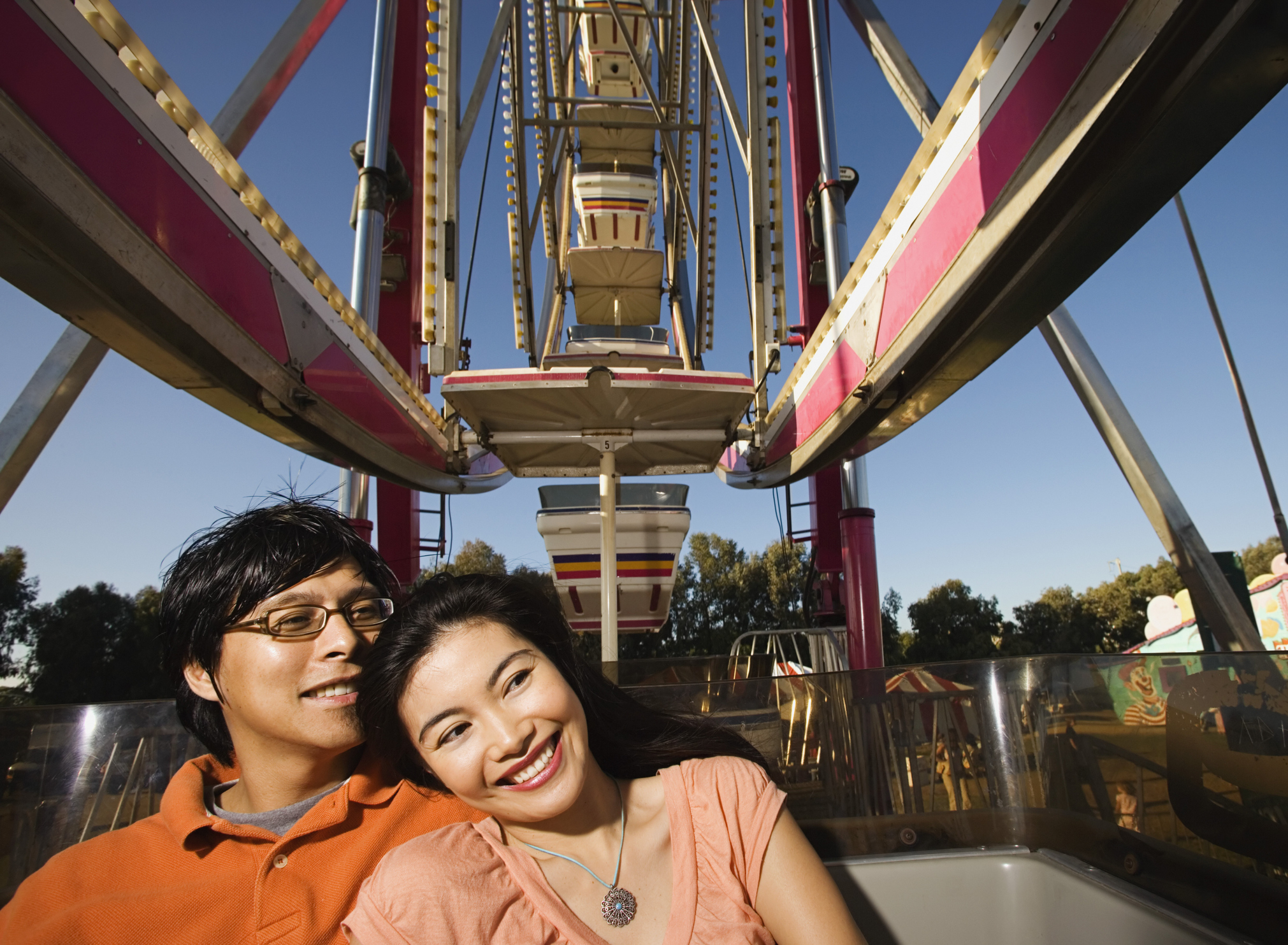 Couple smiling together on a Ferris wheel