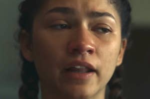 Close-up of Zendaya with a tearful expression, appearing in an emotional scene