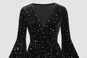 Dark dress with a celestial pattern, long sleeves, and a pleated skirt