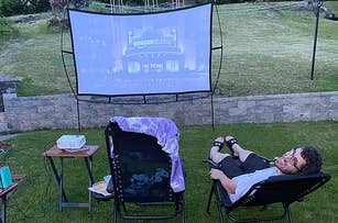 reviewer photo of the movie screen set up in a backyard