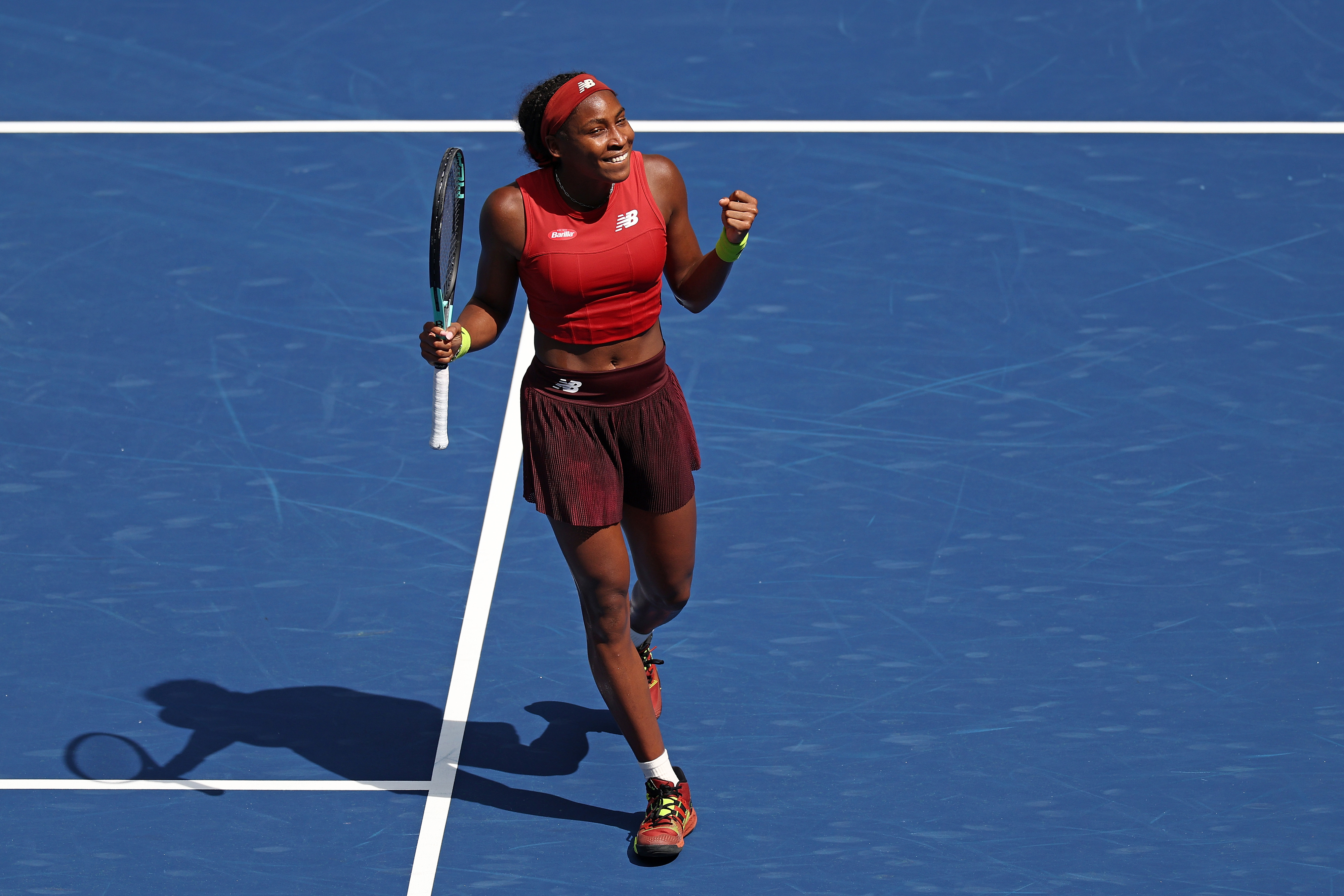 Coco Gauff celebrating a point on the court