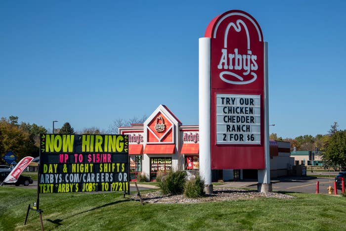 Arby&#x27;s restaurant signage with a hiring advertisement and promotional food deal