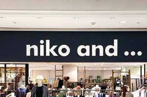 Signboard reading 'niko and...' above a store entrance with visible hats and accessories