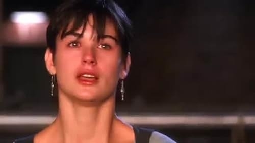 Woman with short hair and earrings, expressing concern