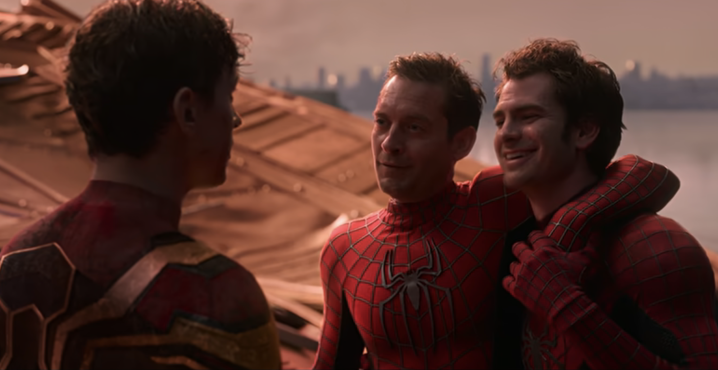 Three Spider-Man characters in costumes posing together by a lake