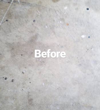reviewer's before phot of a stained concrete floor