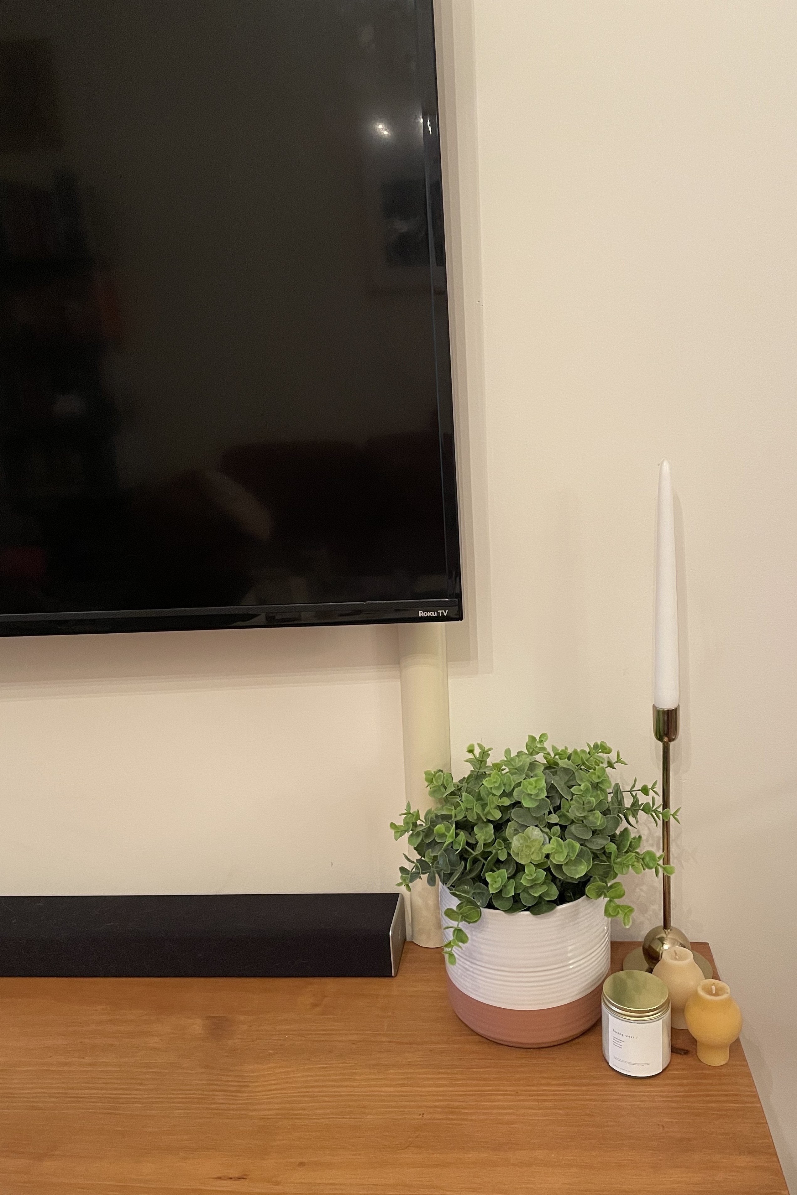 close up of same BuzzFeed editor's TV with cord cover