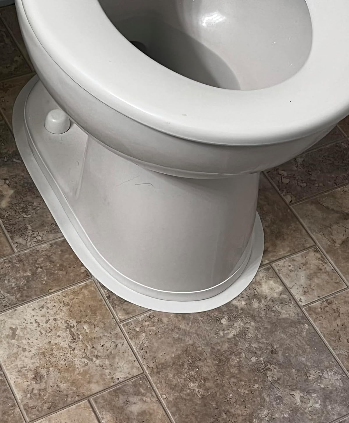 reviewer after photo of toilet base now sealed with the tape