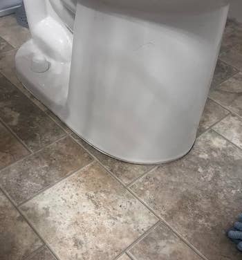 reviewer before photo of toilet base without any sealant