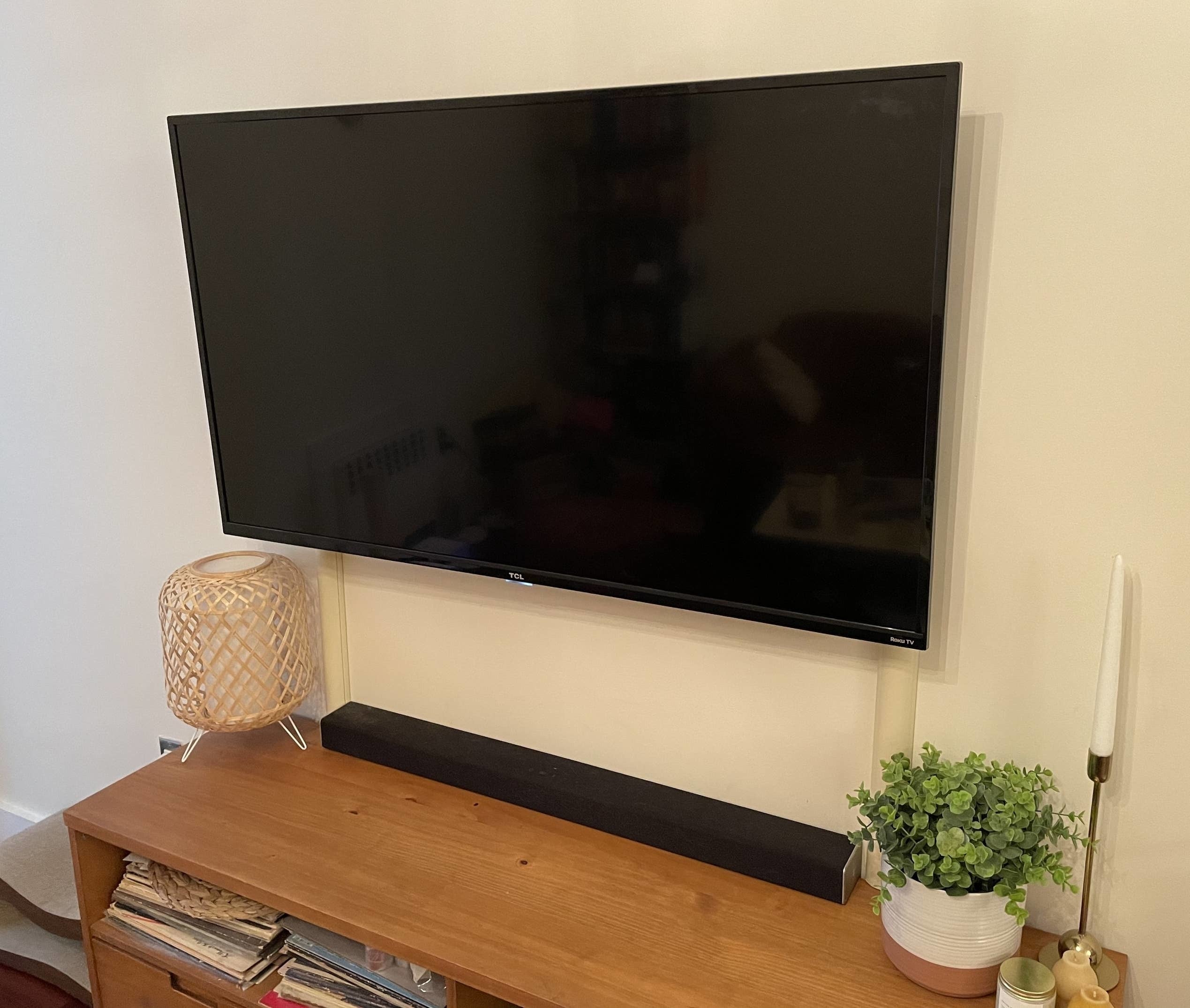 BuzzFeed editor's flat-screen TV with cord cover concealing cables