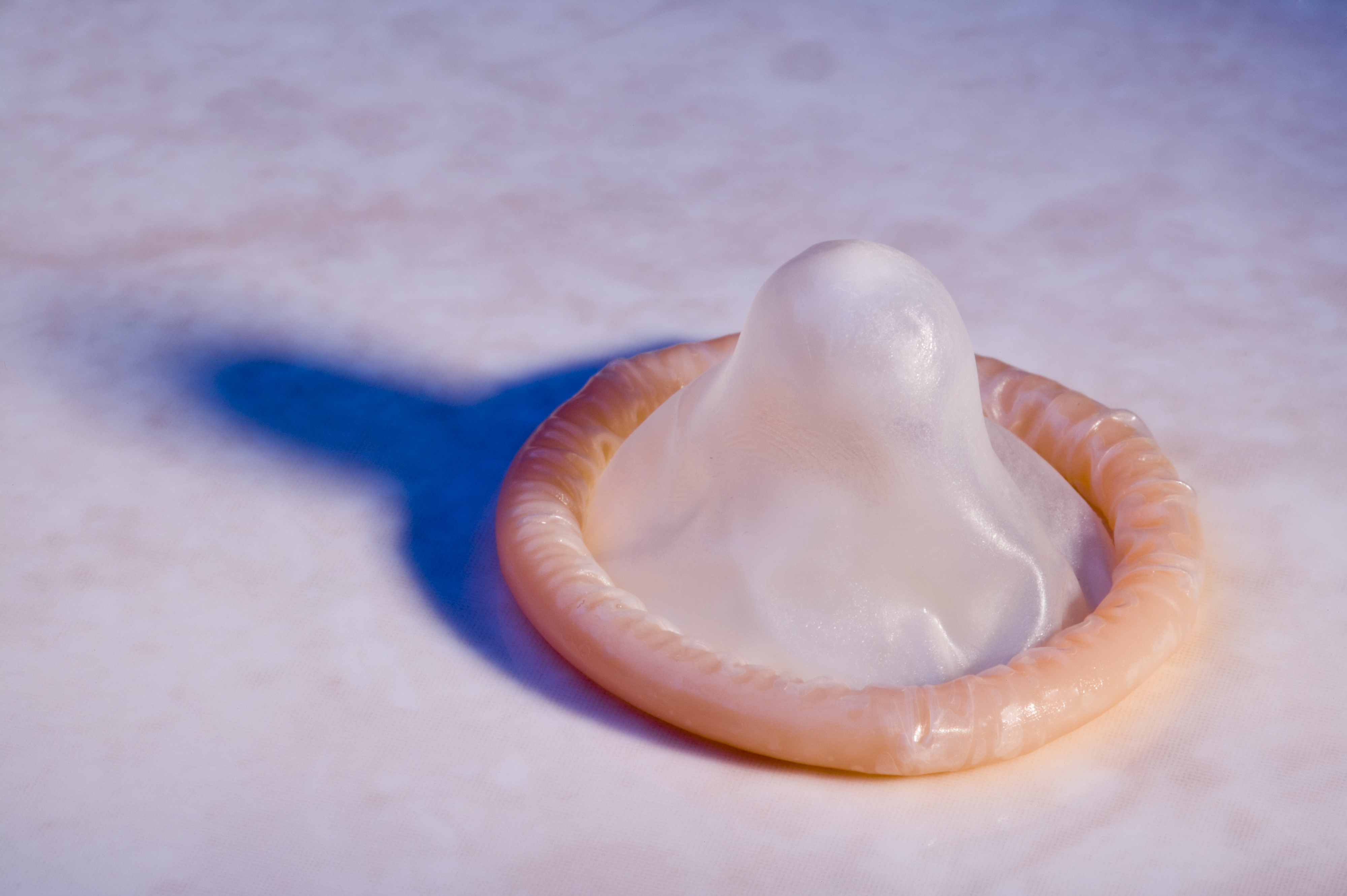 Condom lying on a surface, relevance to travel suggests safe sex practices while traveling