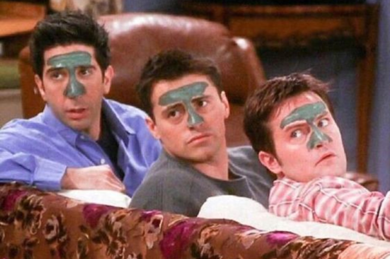 Ross, Joey, and Chandler from "Friends" with face masks on.