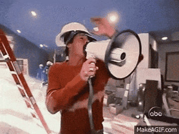 Ty Pennington yelling into a microphone