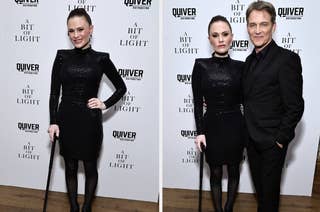 Actress in sequined black dress with cane alongside actor in a suit, posing at 'A Bit of Light' event