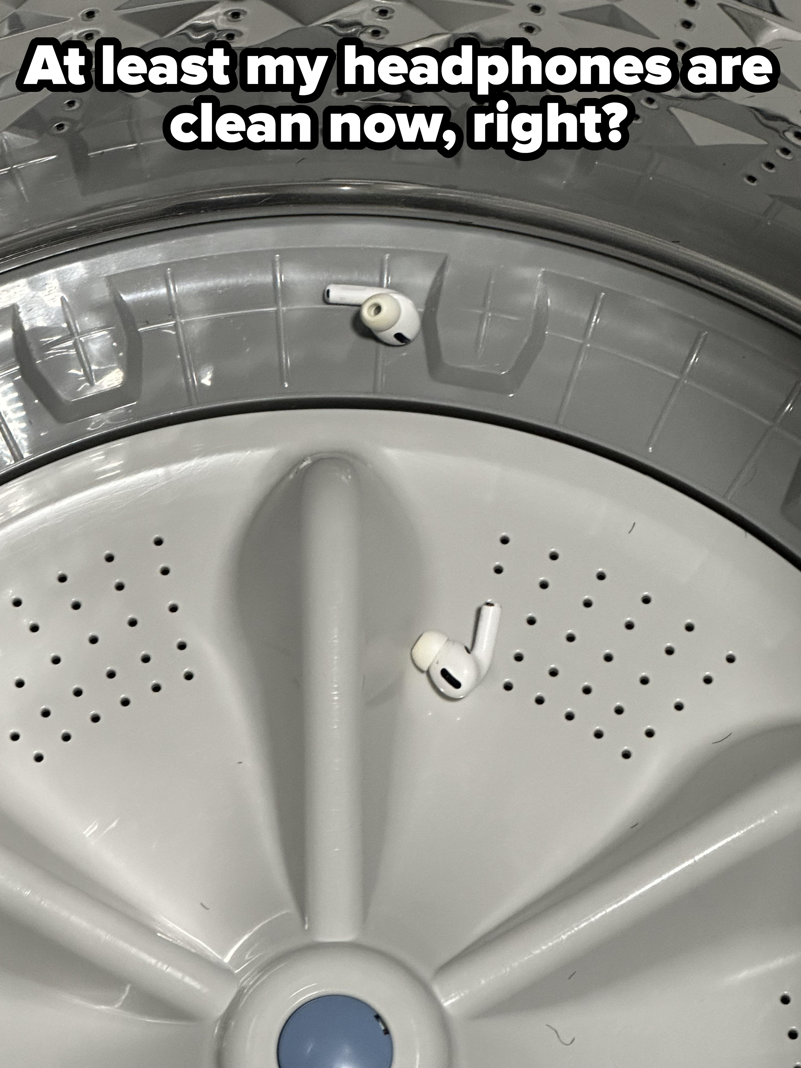 An AirPod rests inside a washing machine, next to the drum&#x27;s rib - a common laundry mishap