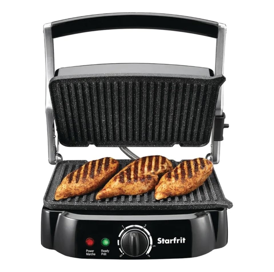 Panini press with three grilled sandwiches inside