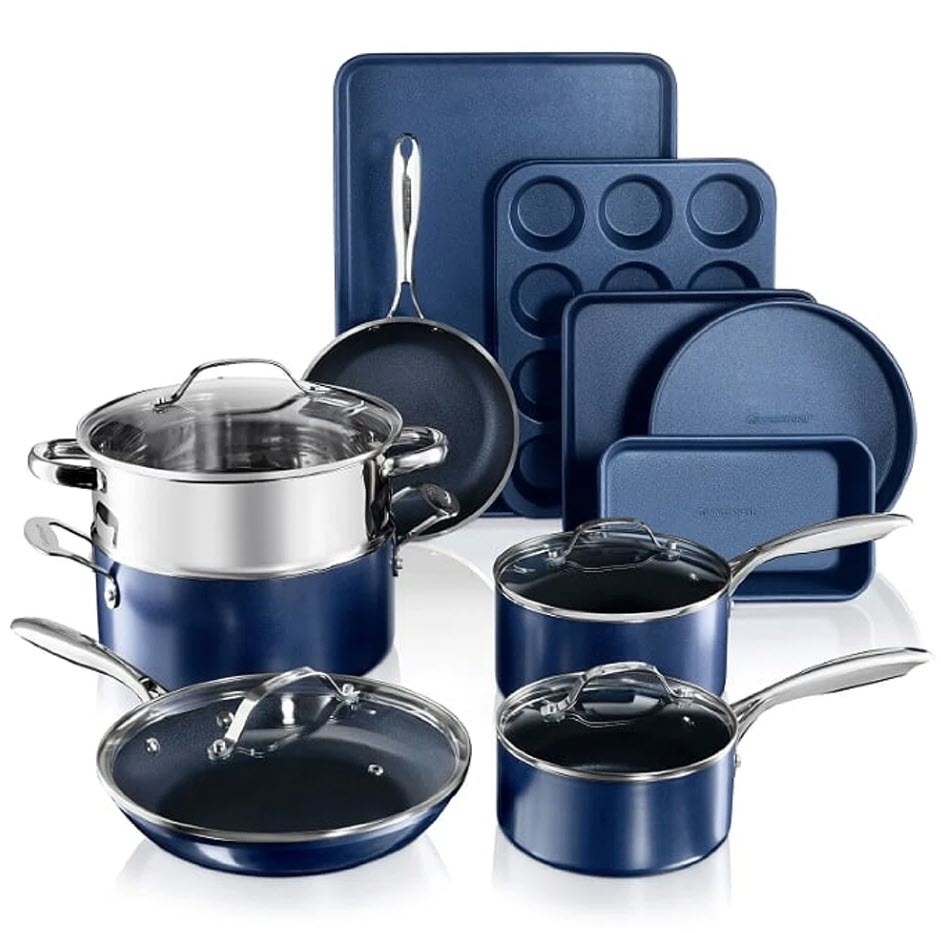 A set of blue kitchen cookware including pots, pans, lids, a muffin tin, and baking sheets