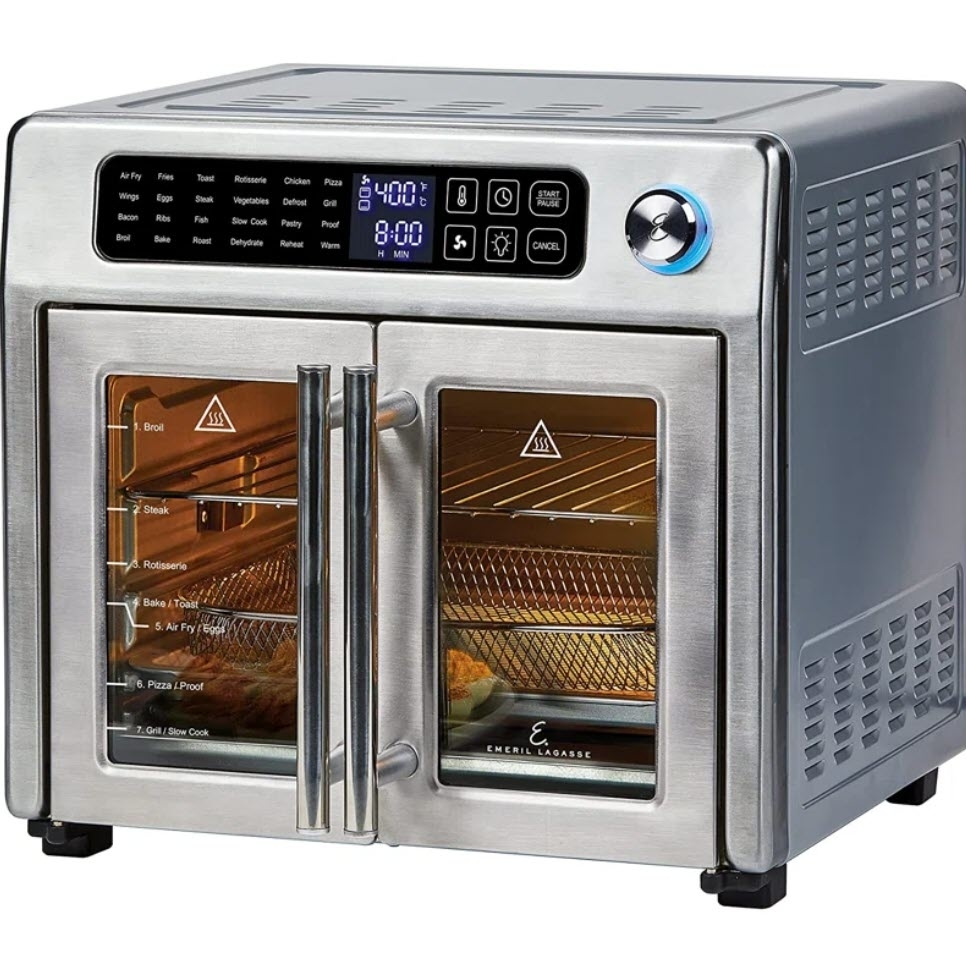 Countertop convection oven with digital display and food cooking inside