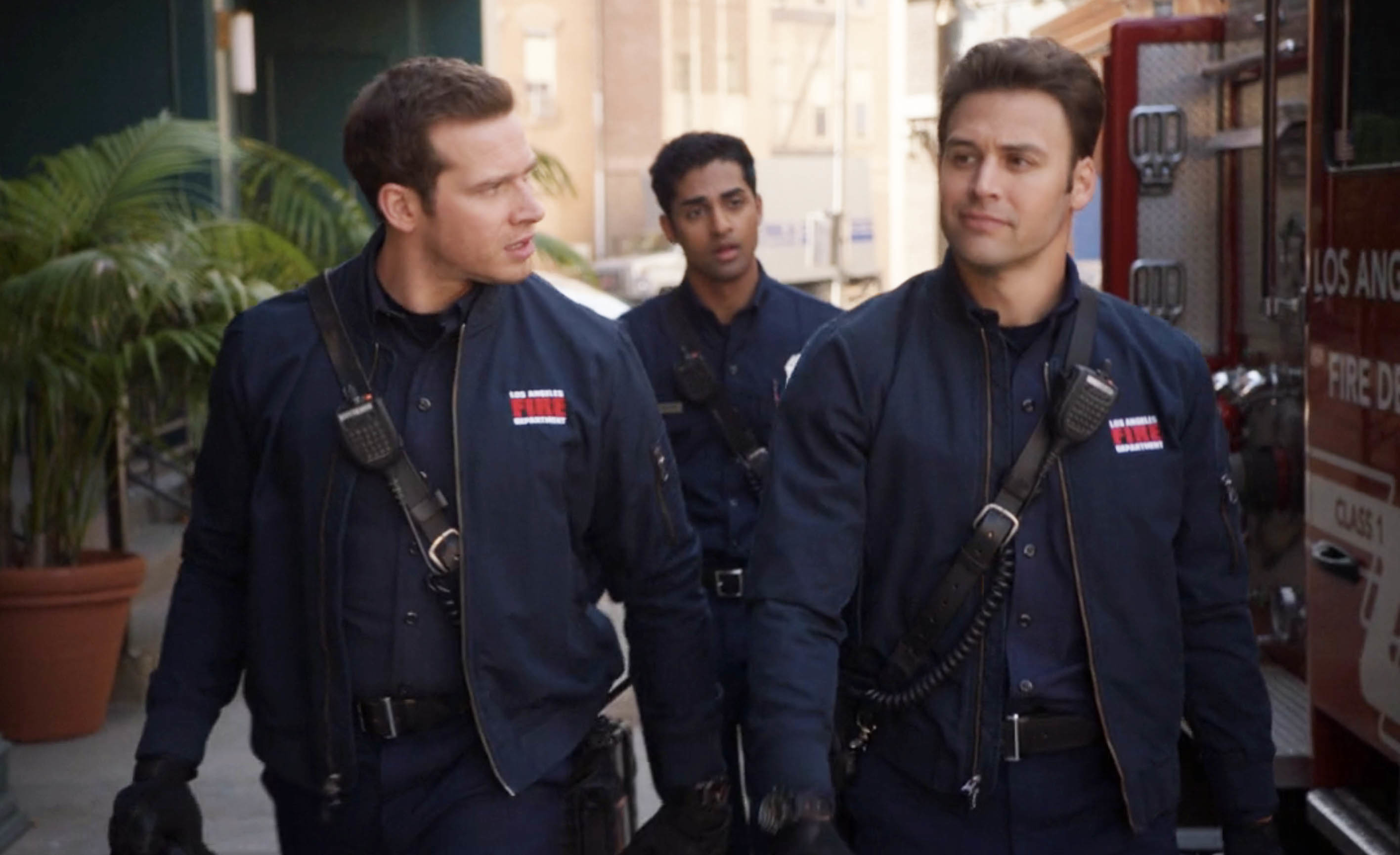 Eddie and Buck walking in uniform in 9-1-1