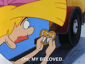 Helga holding pic of Arthur in a gold heart-shaped frame saying &quot;oh, my beloved.&quot;