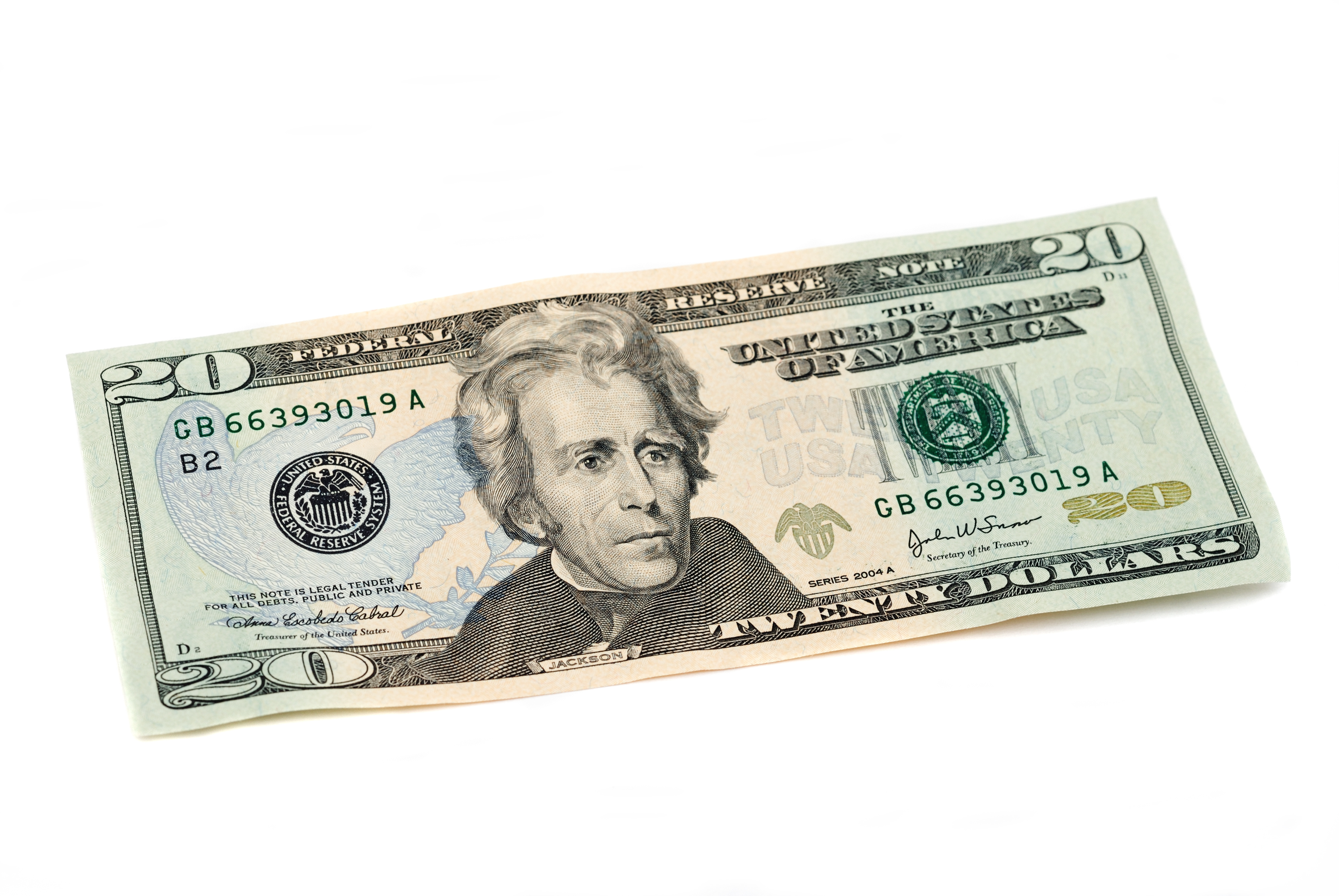 U.S. twenty-dollar bill with Andrew Jackson&#x27;s portrait angled on a surface