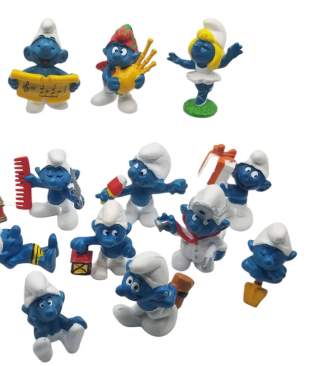 Collection of Smurf figures in various poses and occupations