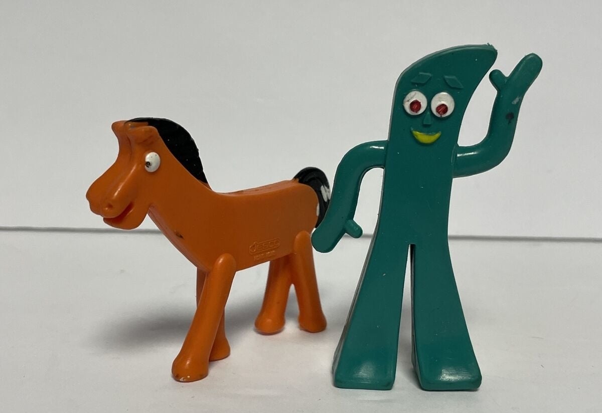 Toy figures of Gumby and Pokey standing side by side