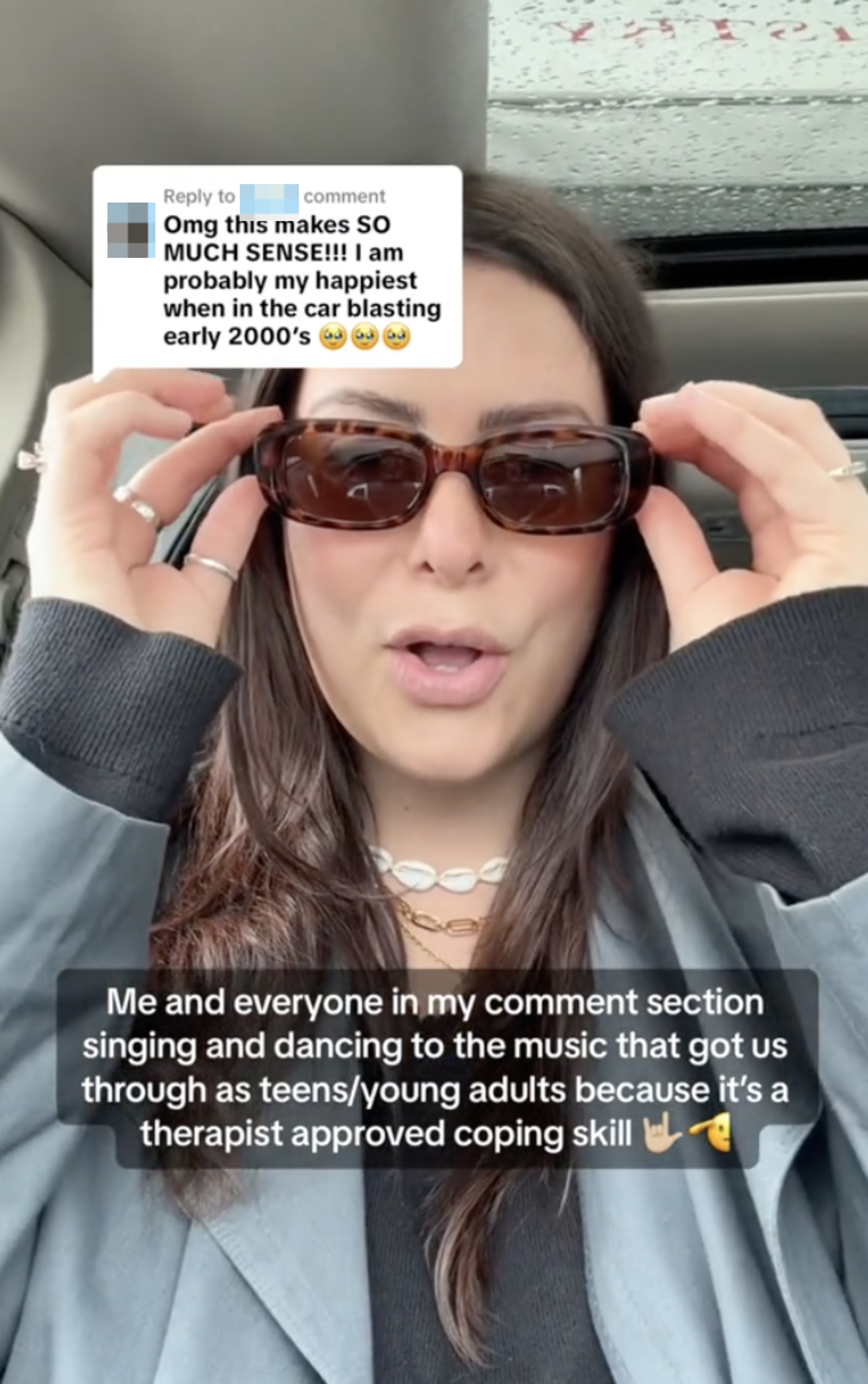 Nikki in her car putting on sunglasses, reacting to comment about music from early 2000s being therapeutic