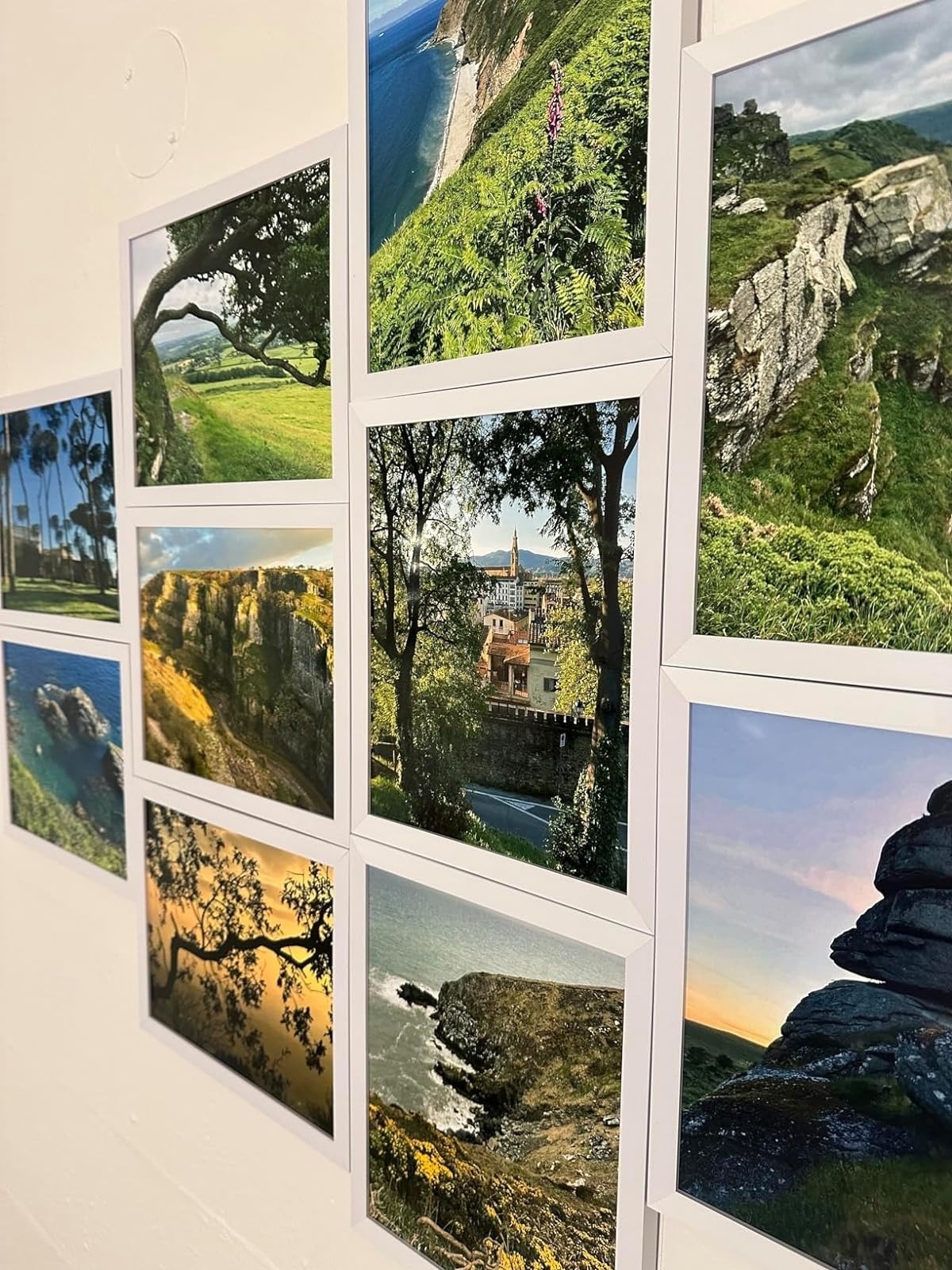 Collage of scenic landscape photos on a wall in matching frames