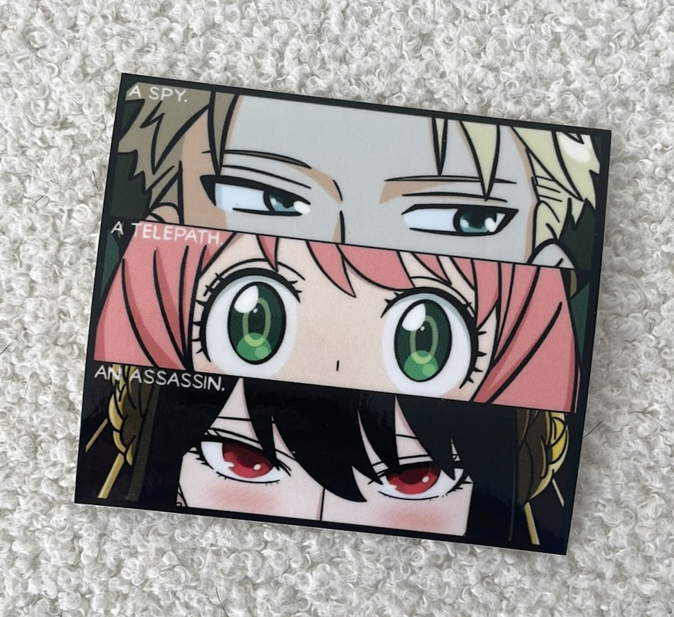 Anime character sticker featuring a spy, a telepath, and an assassin from Spy x Family