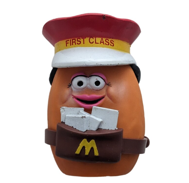 McDonald&#x27;s Happy Meal Toy, a Potato Head character dressed as a mail carrier with a letter