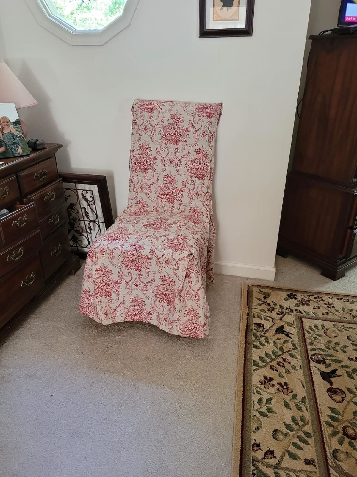 A floral patterned chaise lounge in a home interior setting