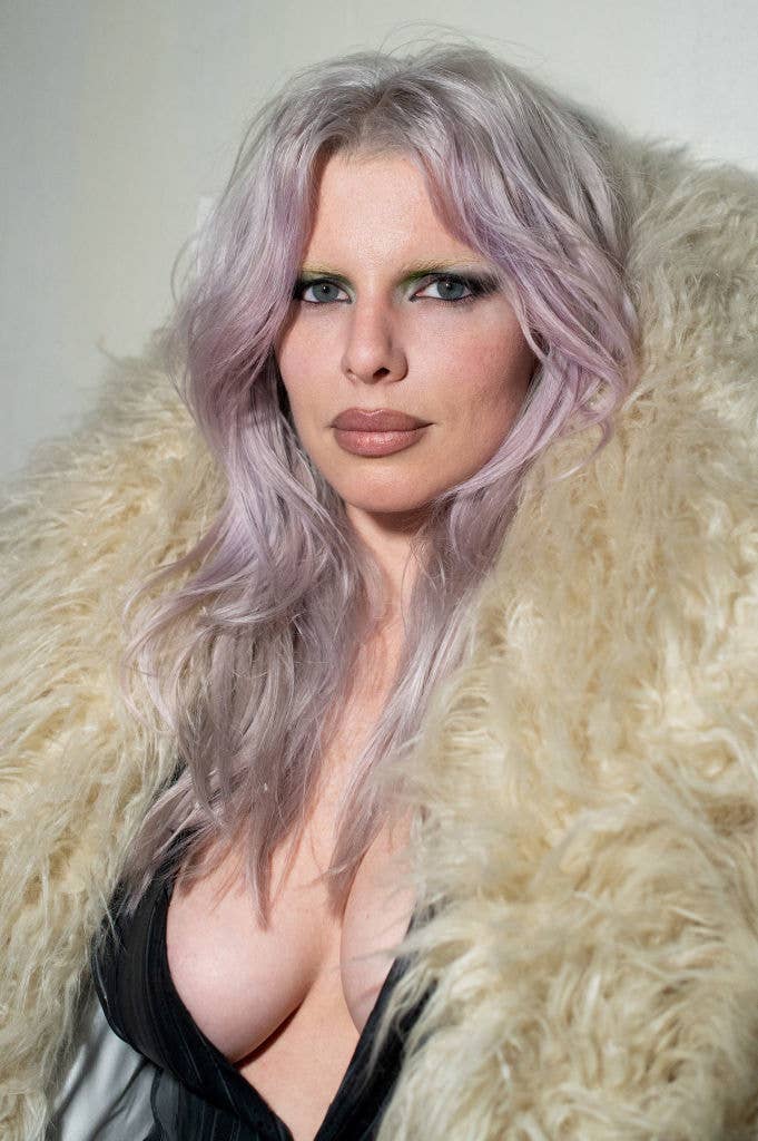 Closeup of Julia Fox rocking dyed wavy hair
