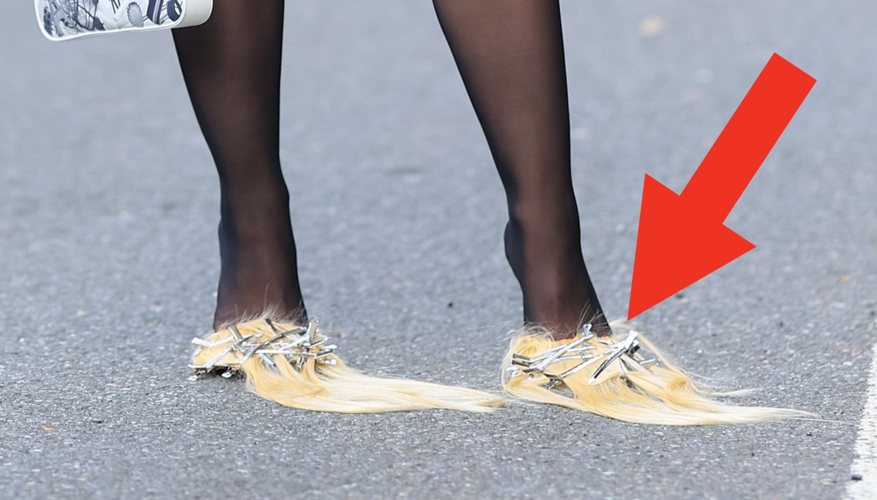 Arrow pointing to Julia Fox's shoes