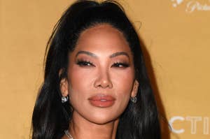 Kimora Lee Simmons in a v cut dress and diamond jewelry at an event