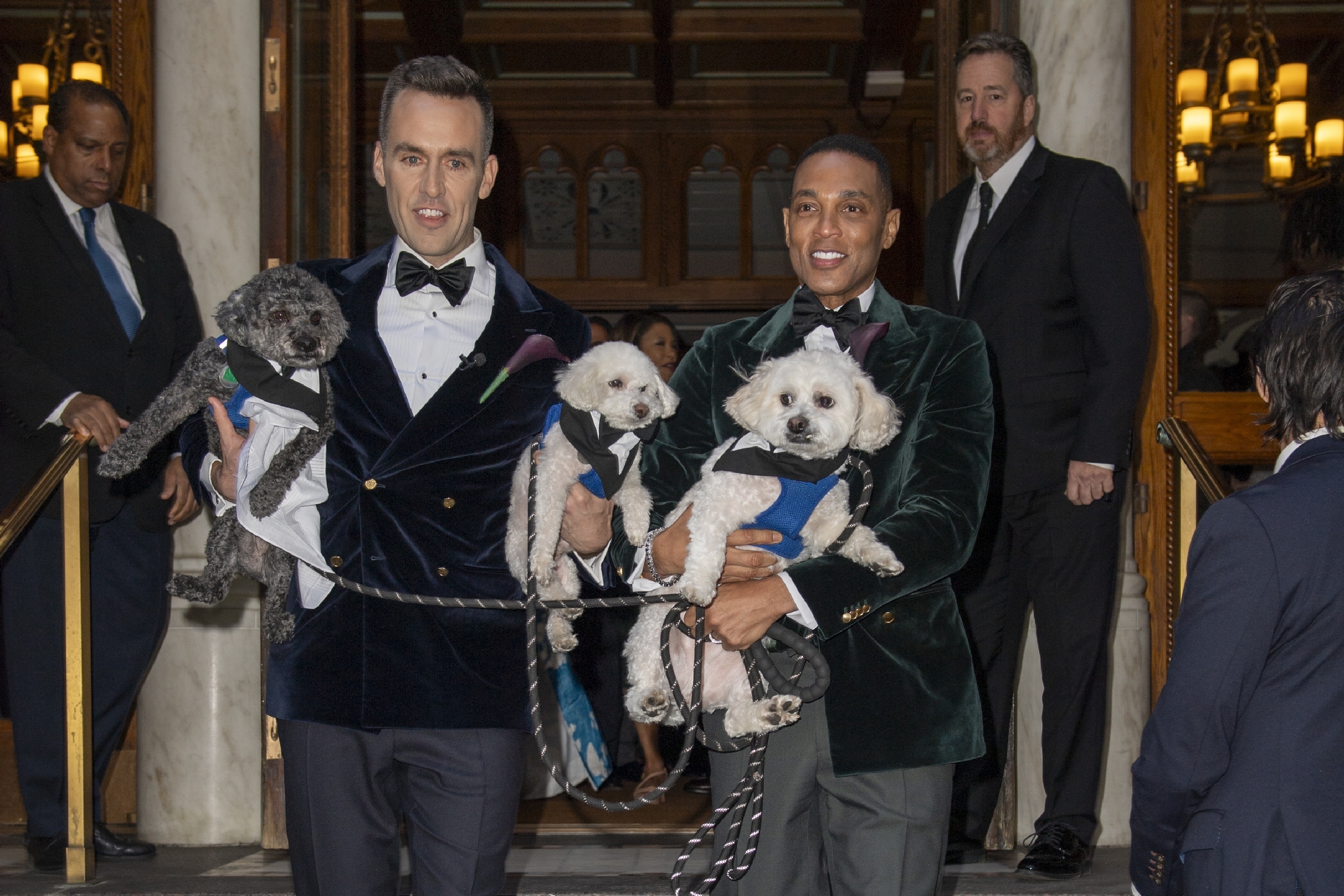 Tim Malone and Don Lemon holding their dogs