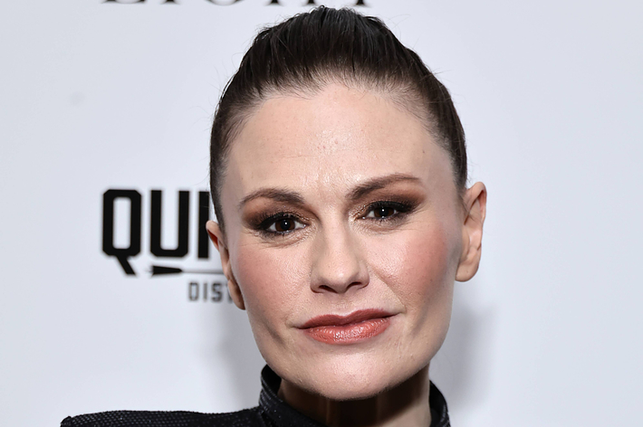 Celebrity at event wearing a sleek outfit with hair pulled back