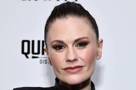 Celebrity at event wearing a sleek outfit with hair pulled back