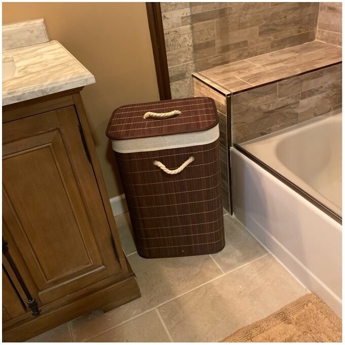 A reviewer photo of the laundry hamper with rope handles