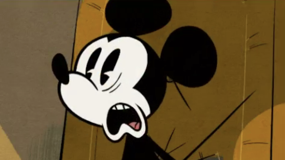 Mickey Mouse appears in a classic animation style, making a shocked face
