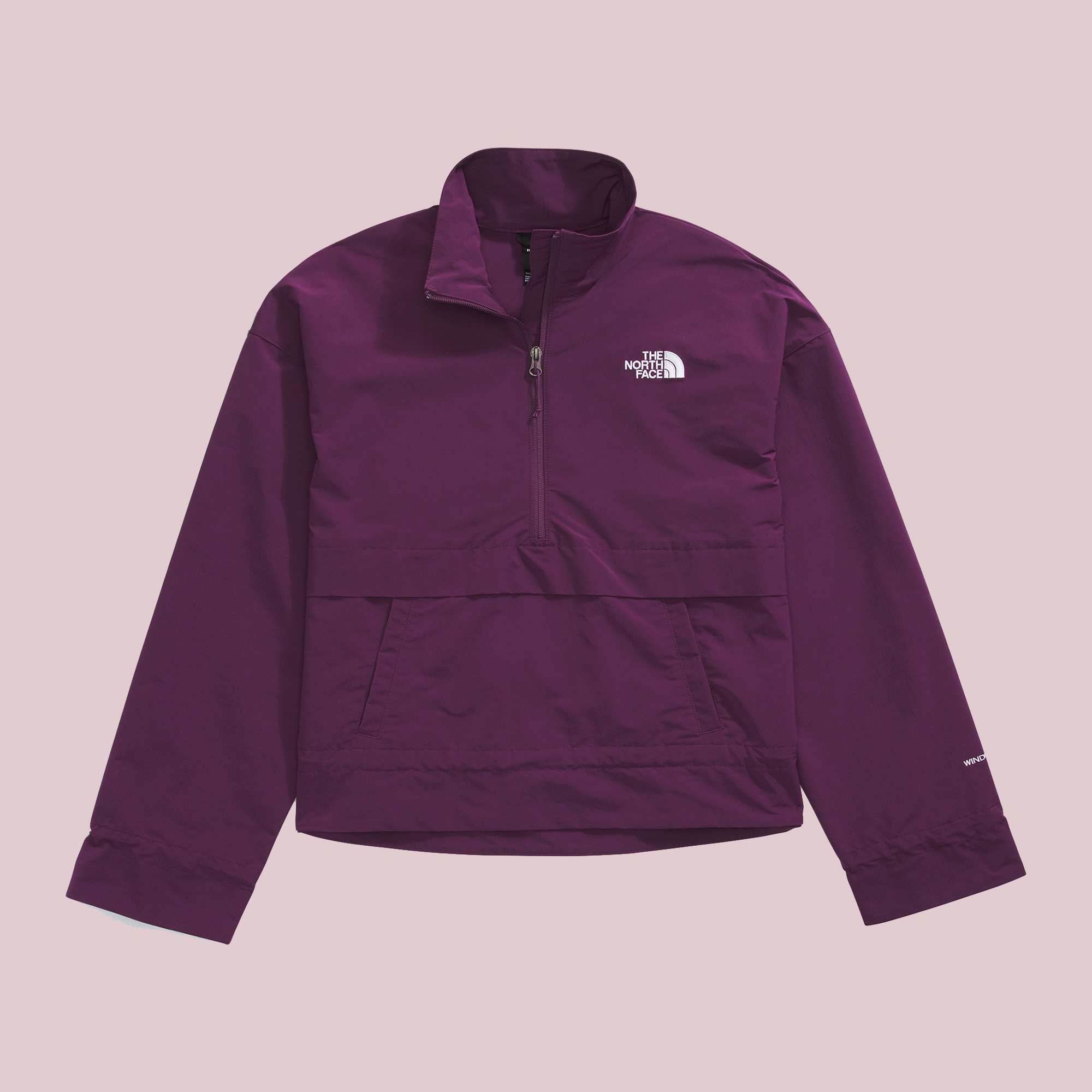 Purple half-zip the North Face jacket against a plain background