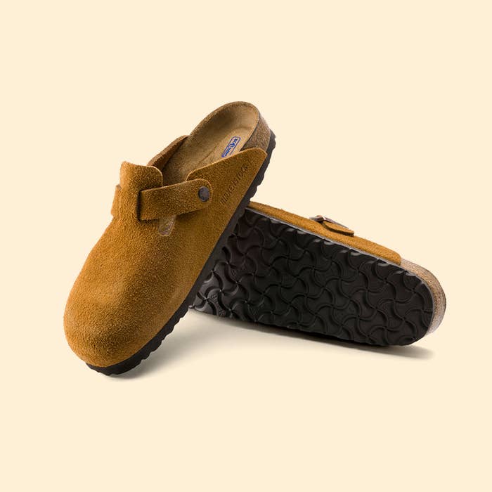 Pair of suede clogs on a plain background, ideal for casual wear