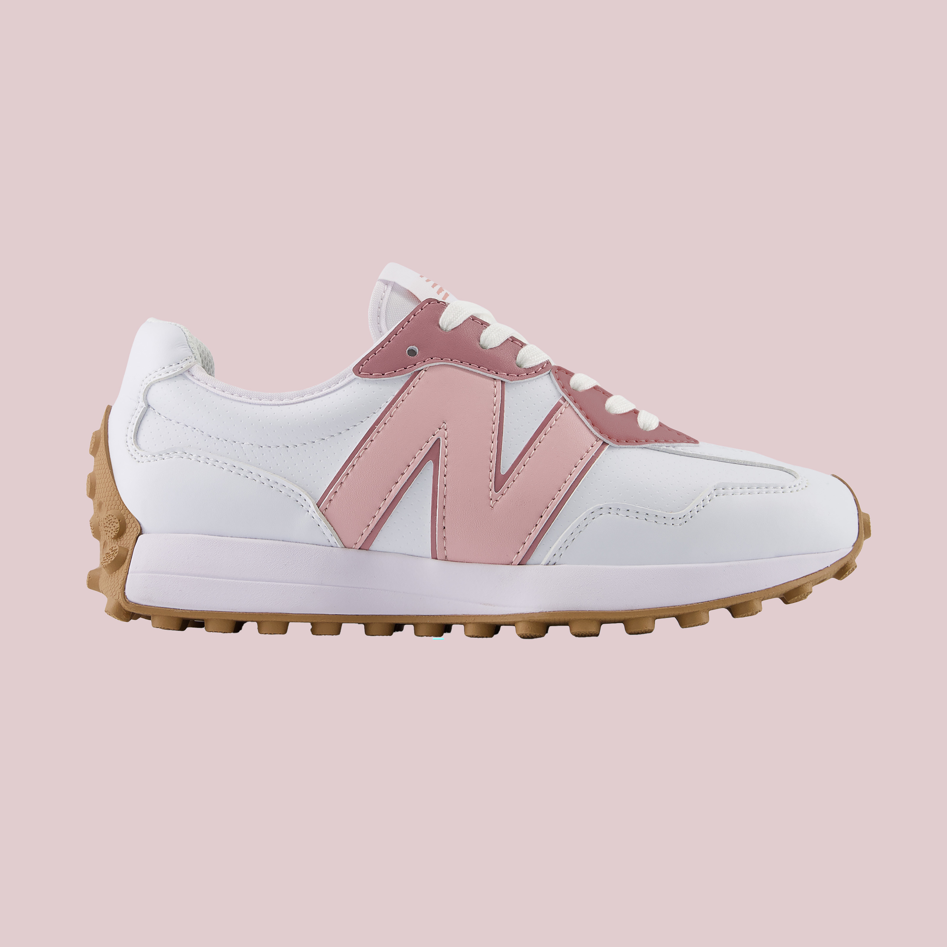 White-and-pink New Balance sneaker with a gum sole on a plain background