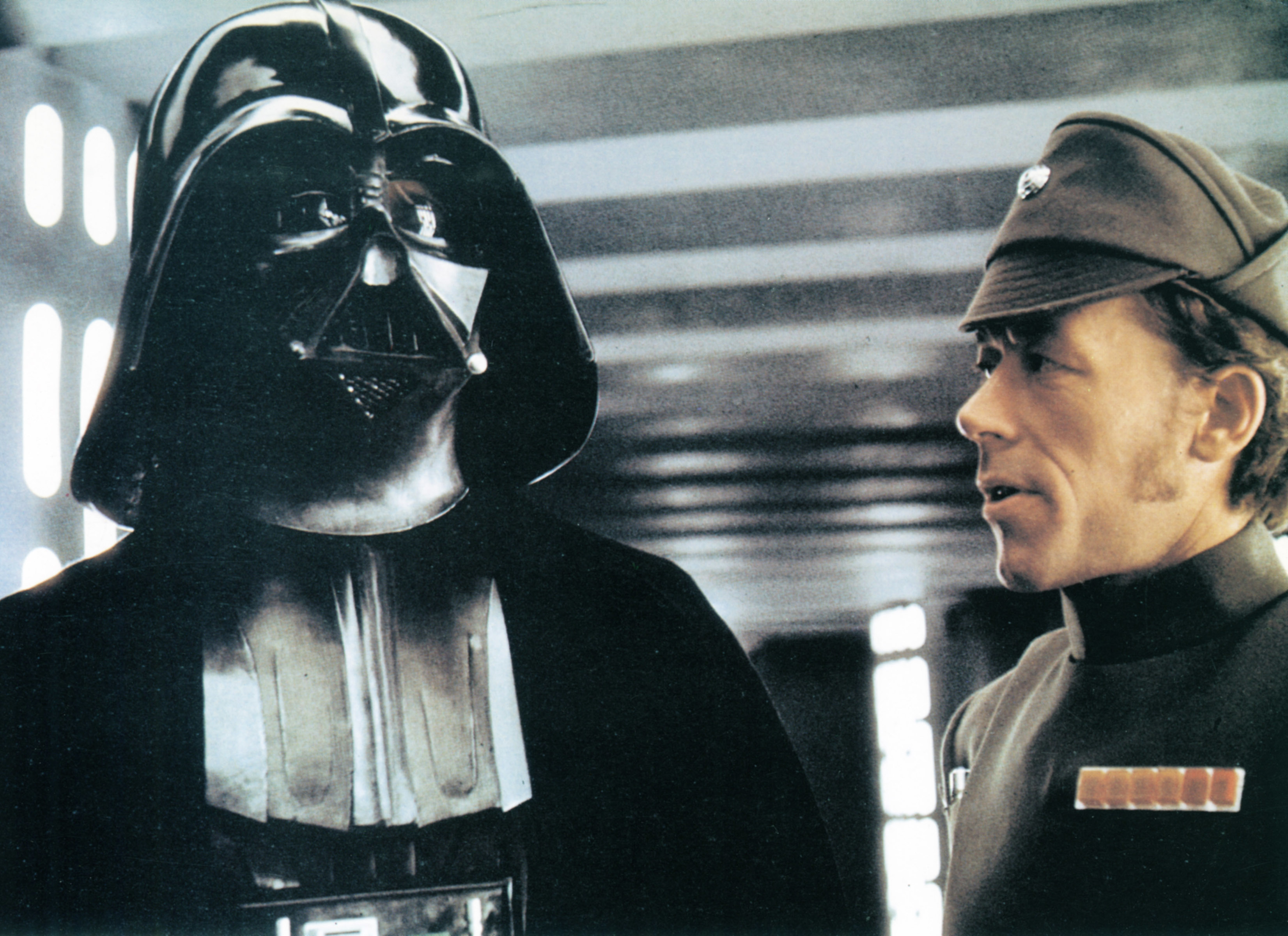 Darth Vader and Imperial Officer stand together aboard the Death Star