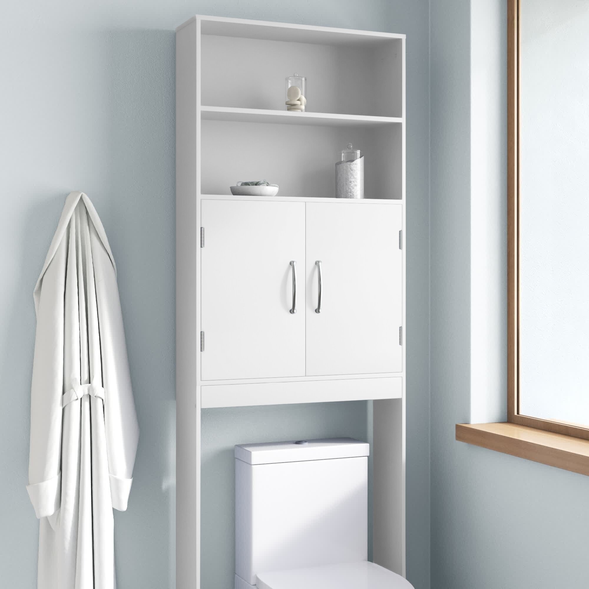 White bathroom cabinet over a toilet, with shelves and closed compartments