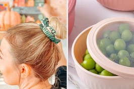 Person with a hair bun using a patterned scrunchie; a bowl of fresh grapes on a plate