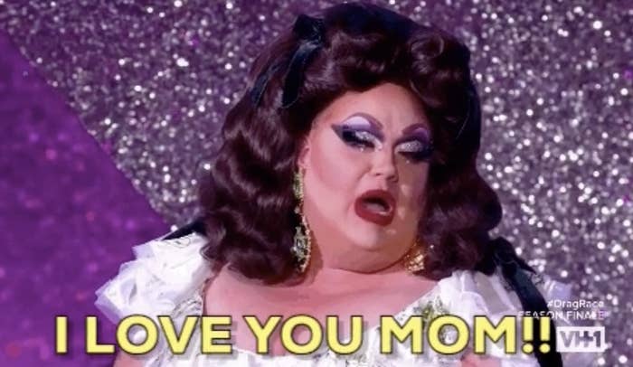 Drag performer in elegant attire with text "I LOVE YOU MOM!!" in a show of affection