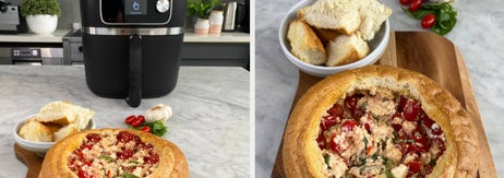 Air fryer on kitchen counter and a bread bowl with dip on a wooden board, sticker with text 'win'